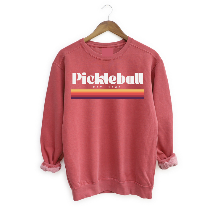 Experience the retro vibes and timeless comfort of our 1965 Pickleball Women's Sweatshirt. Step back in time and pay tribute to pickleball's origins with this fun, old-school, vintage  collection that blends classic charm with modern style. Feel the premium softness of the fabric on your skin, and express your timeless style on and off the court. You will love how this fits!