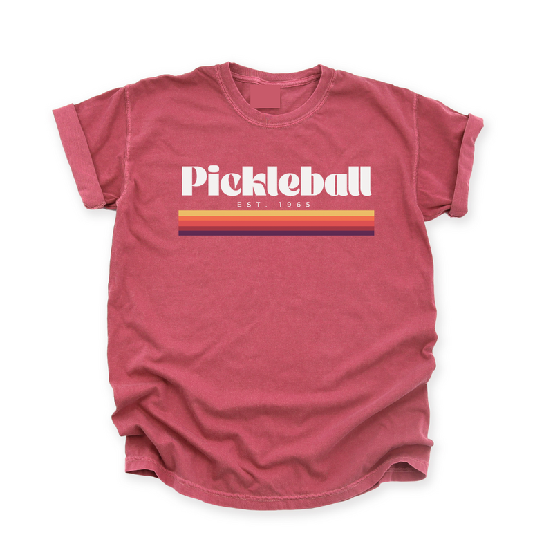 Experience the retro vibes and timeless comfort of our 1965 Pickleball Women's T-shirt. Step back in time and pay tribute to pickleball's origins with our "old-school",vintage vibe collection that blends classic charm with modern style. Feel the premium softness of the fabric on your skin, and express your timeless style on and off the court. Wear it on and off the pickleball court!