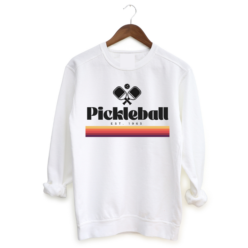 Experience the retro vibes and timeless comfort of our 1965 Pickleball Women's Sweatshirt. Step back in time and pay tribute to pickleball's origins with this fun, old-school, vintage  collection that blends classic charm with modern style. Feel the premium softness of the fabric on your skin, and express your timeless style on and off the court. You will love how this fits!