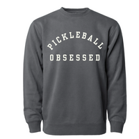 Show your pickleball passion with our Pickleball Obsessed Sweatshirt! Crafted with impeccable quality and offered in a variety of pigment dyed colors.  You'll love how this sweatshirt works for dominating the courts or adding a dash of pickleball flair to your everyday style.