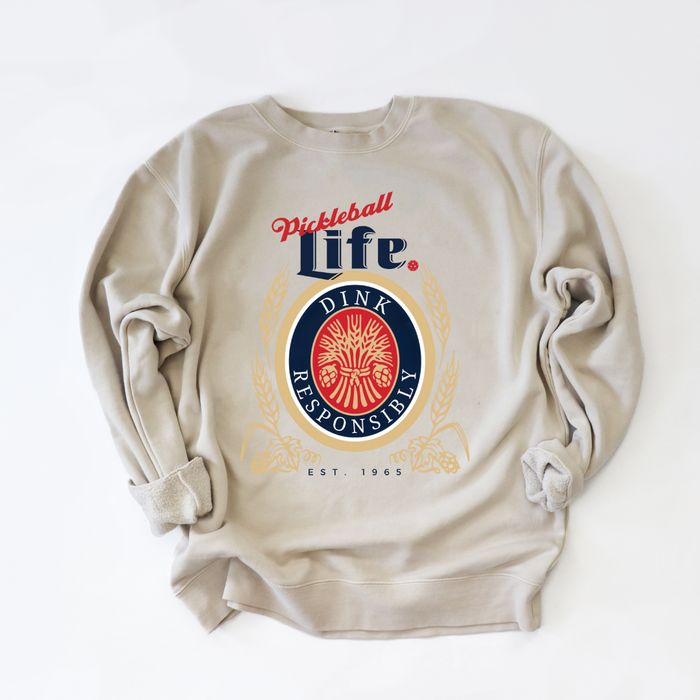 Show off your love of pickleball with the ultra-soft and versatile Dink Responsibly Unisex Sweatshirt. This super soft and stylish sweatshirt is designed for everyone, giving you comfort and style in one wearable package. Perfect for the pickleball court and your everyday adventures!