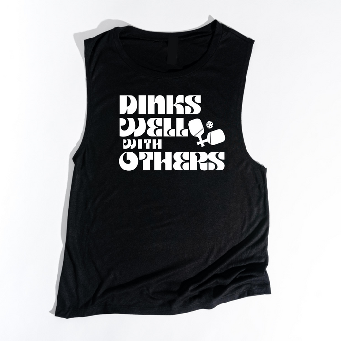 Indulge in the art of the dink with our Dinks Well With Others Tank! This one radiates playful charm and unmatched comfort, making it your go-to on and off the courts. Showcase your love for pickleball and your witty side in this statement piece that's sure to spark conversations and turn heads. Dink well, and do it in style in this tank top!! 