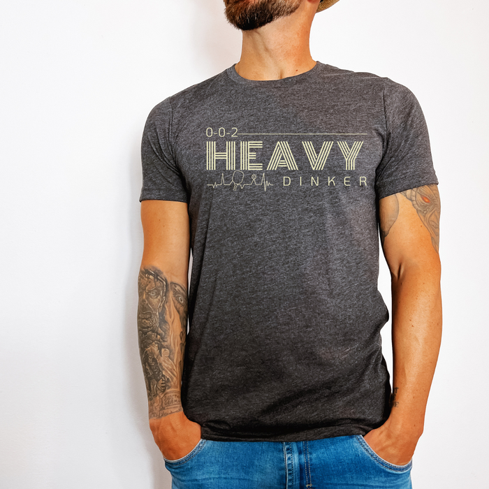  Step up your pickleball game in style with the Heavy Dinker Men's Jersey Tee. Featuring artfully designed prints inspired by the finesse and power of the dink shot, this tee is a masterpiece of style, comfort, and versatility. Show everyone your strength and grace both on and off the court. Be powerful and cool -- let your style speak for itself.