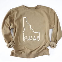 Elevate your style and showcase your love for both the Gem State and pickleball with our Pigment Dyed Idaho Pickleball Sweatshirt!   Crafted with care, this sweatshirt is more than just an article of clothing; it's a statement of pride and passion. 