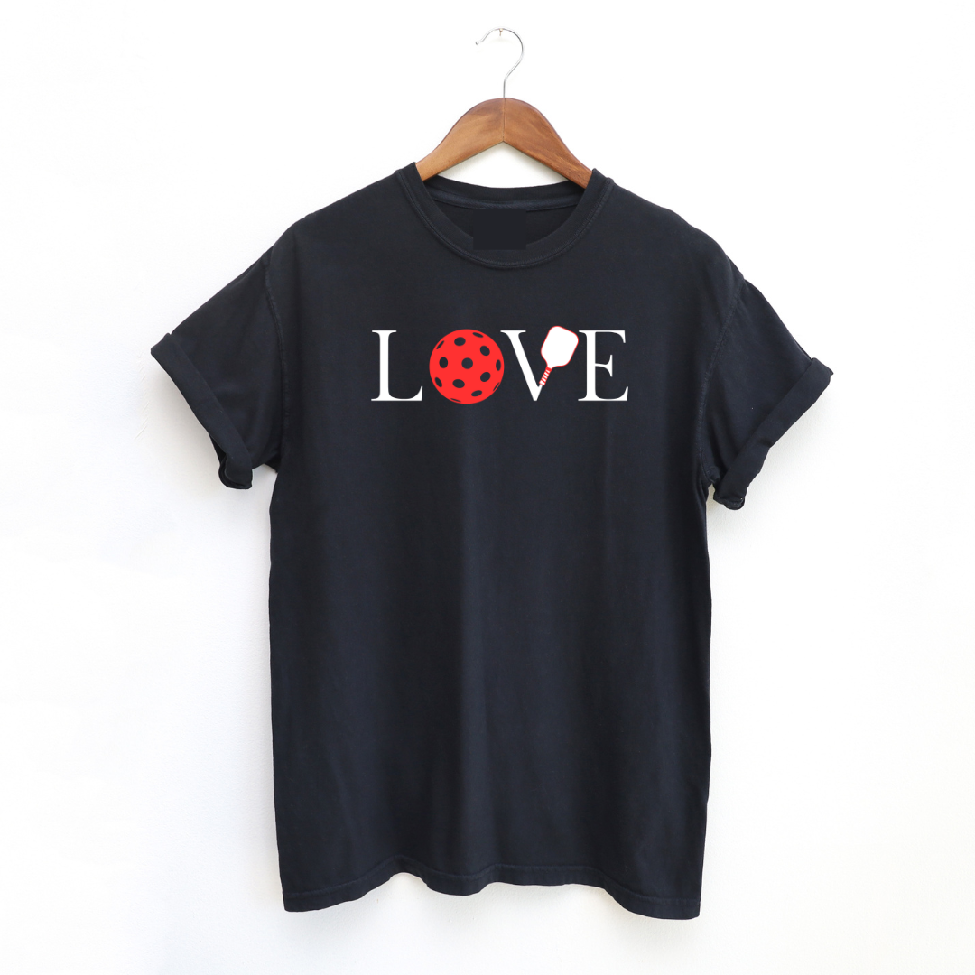 Get ready to show your love for pickleball with our LOVE TEES!  You'll love how soft and comfortable they are. This LOVE Pickleball collection is perfect for wearing on or off the pickleball courts. Grab yours now and share your love for the game with the world!   Comfort Colors TEES are garment dyed for that lived in feel and almost no shrinkage at home! They are top quality and just might become your favorite tees like they are ours! 