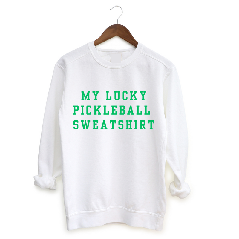 Introducing our festive Limited Edition My Lucky Pickleball Sweatshirt, just in time for St. Patrick’s Day fun! And since this one doesn't have four leaf clovers on it you can wear it any day of the year.  Your opponents will love your confidence!   Elevate your game with this charm-packed sweatshirt. Beyond its super-soft feel, it's a fun companion on and off the court. Who knows, it might just sprinkle some pickleball luck your way!   Grab yours and let the good vibes roll! 