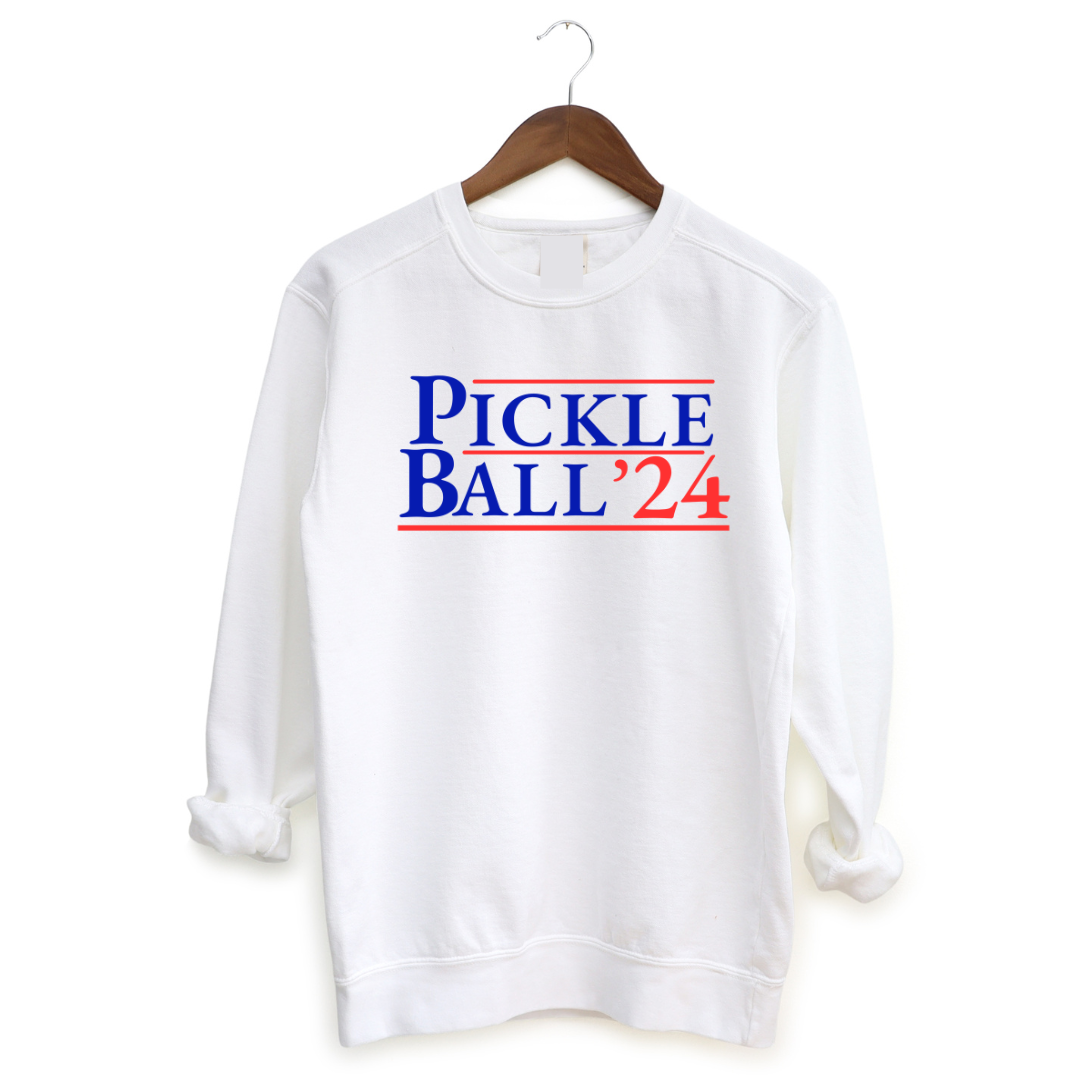<p class="p1">Introducing our EXCLUSIVE “PickleBall ‘24” Sweatshirt – because who says politics can’t be a dill-lightful game?<span class="Apple-converted-space">&nbsp;</span></p> <p class="p1">Embrace the ultimate combo of PickleBall ‘24 and the upcoming 2024 Election!! Wear this hoodie proudly and let everyone know you’re on #TeamPickle.<span class="Apple-converted-space"> Oh and guess what? This bad boy is UNISEX!&nbsp;</span></p>