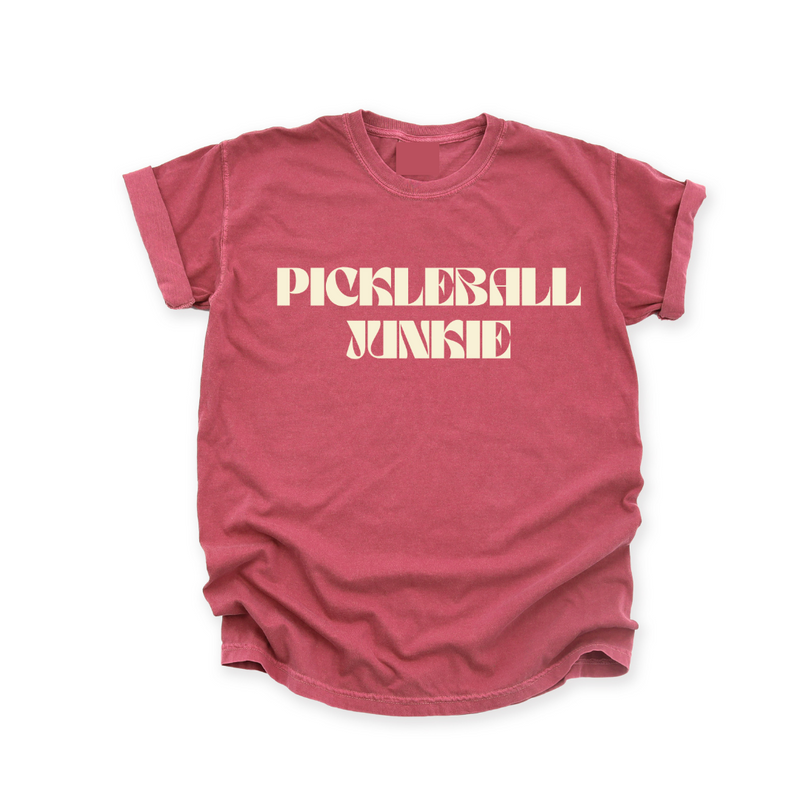 Embrace your pickleball obsession with our "Pickleball Junkie" tee!If you're addicted to the thrill of the game, this tee is your perfect match. Crafted with awesome quality, it's not just a shirt; it's a declaration of your pickleball passion. Great for both on and off the court, this tee is destined to become your go-to favorite. Feed your pickleball addiction in style!