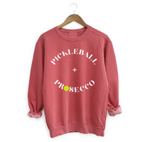  Introducing our Pickleball + Prosecco Sweatshirt, where sport meets sophistication! Crafted for comfort and style, this sweatshirt is the perfect blend of cozy warmth and playful elegance. Whether you're dominating the pickleball court or sipping prosecco with friends, this sweatshirt is your go-to choice for casual chic. Elevate your wardrobe and celebrate the joy of both pickleball and bubbly in this unique and fashionable piece. Cheers to sporty style and effervescent moments!