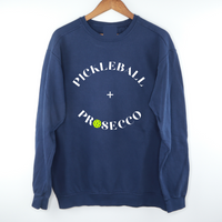  Introducing our Pickleball + Prosecco Sweatshirt, where sport meets sophistication! Crafted for comfort and style, this sweatshirt is the perfect blend of cozy warmth and playful elegance. Whether you're dominating the pickleball court or sipping prosecco with friends, this sweatshirt is your go-to choice for casual chic. Elevate your wardrobe and celebrate the joy of both pickleball and bubbly in this unique and fashionable piece. Cheers to sporty style and effervescent moments!