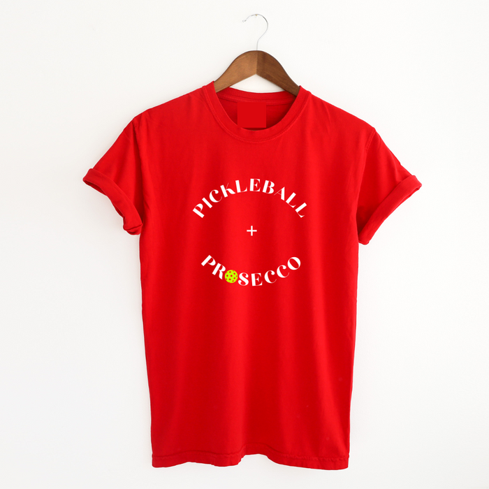 Introducing our Pickleball + Prosecco Tee, where sport meets sophistication! Crafted for comfort and style these tees are top quality as well as the perfect blend of cozy warmth, comfort and playful elegance. 