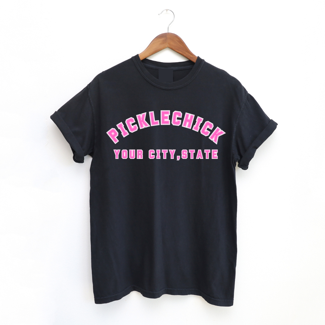 Introducing our exclusive PICKLECHICK Tee! Embrace the PickleChicks spirit and spread joy wherever you go when you wear it! Whether you’re dominating the court or simply enjoying life off the sidelines, wear your PICKLECHICK swag proudly and let your enthusiasm shine. BONUS: You Can Customize It!