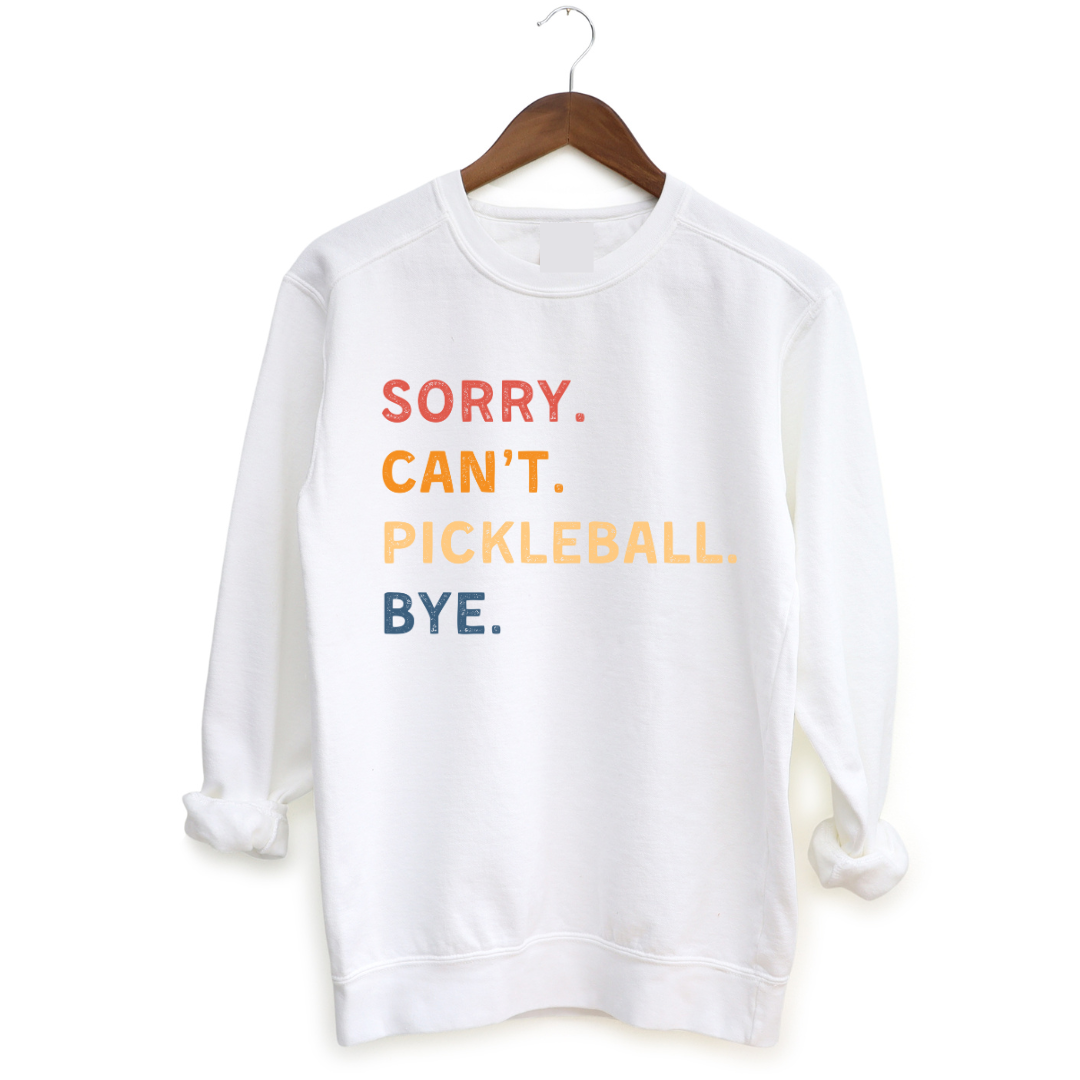 Introducing our "Sorry. Can't. Pickleball. Bye." Sweatshirt – your excuse for a life well-played! This super-soft and ultra-comfortable sweatshirt is designed for the pickleball enthusiasts who want to carry their love for the game wherever they roam.  Perfect for making a statement and staying cozy, it's a must-have addition to your wardrobe. Let this sweatshirt do the talking, and let everyone know you're off to conquer the courts!