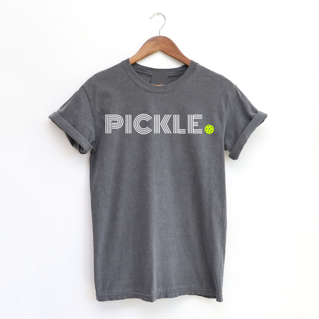 Elevate your pickleball style with our "Straight Up Pickle" tee! This must-have tshirt is more than just apparel - it's a statement. Get ready to serve up style and make a playful statement with these tee! It will add a touch of pickleball vibes to every moment. Perfect for on & off the courts! Don't miss out on this opportunity to show off your passion for the game!